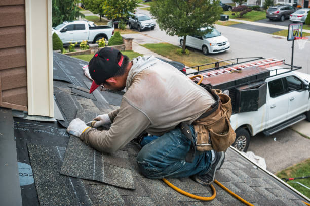 Professional Roofing technician working in Lester, IA